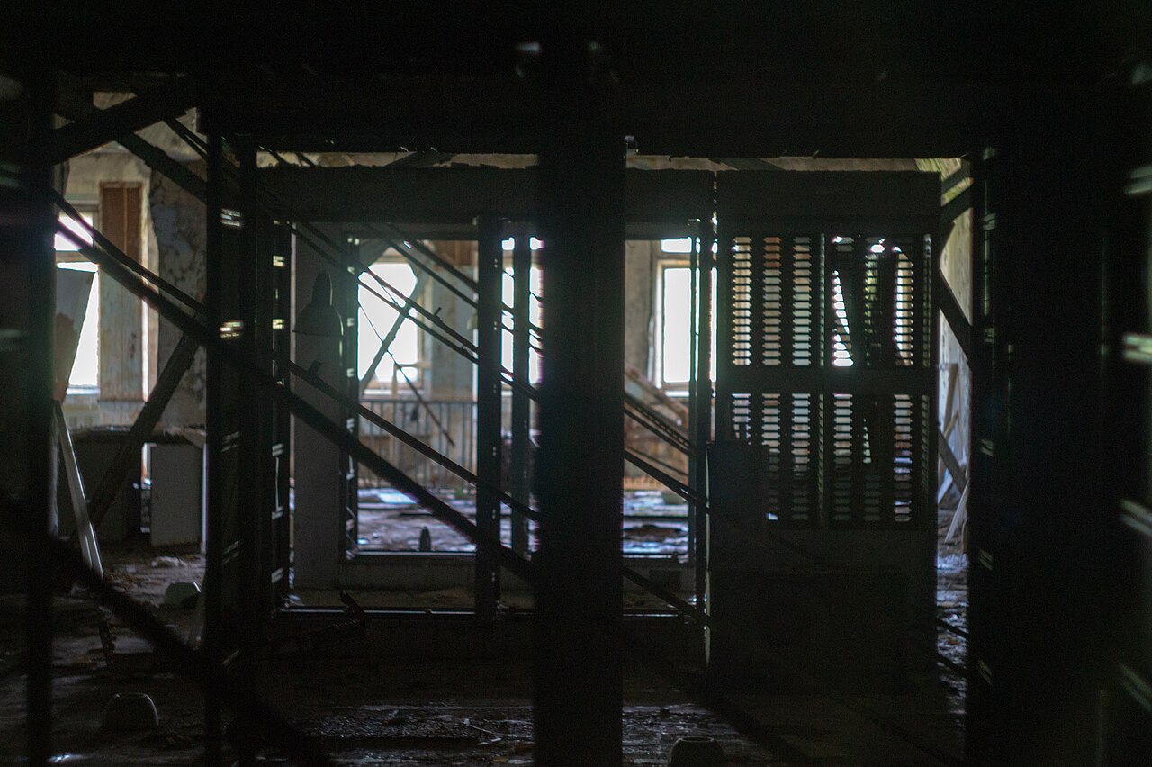 Rows of server racks in a data center representing the computing power behind AI models.
